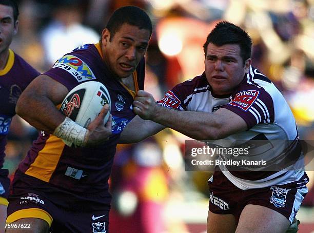 Justin Hodges of the Broncos attempts to push away Jamie Lyon of the Sea Eagles during the round 21 NRL match between the Brisbane Broncos and the...