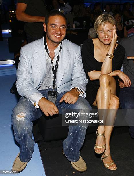 Joe Meli and actress Renee Zellweger attend the Hampton Social @ Ross to watch a concert by Billy Joel at the Ross School on August 4, 2007 in East...