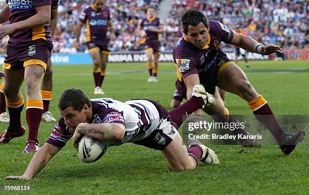 Anthony Watmough of the Sea Eagles scores a try during the round 21 NRL match between the Brisbane Broncos and the Manly Warringah Sea Eagles at...