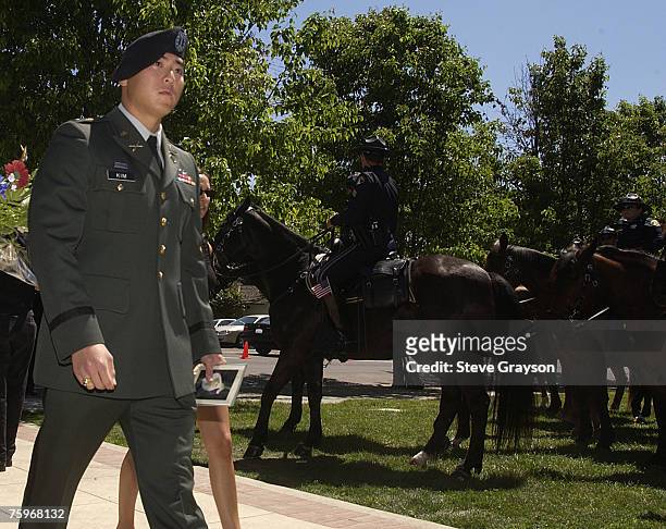 Member of the United States Armed Forces enters the San Jose Rose Garden for the public memorial for Pat Tillman May 3, 2004.