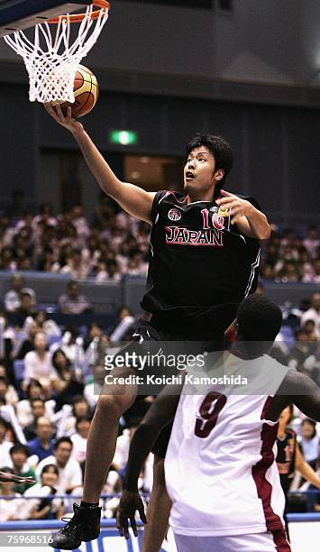 Kosuke Takeuchi of Japan shoots against Qatar during the 2007 FIBA Asia Championship game at Asty Tokushima on August 05, 2007 in Tokushima, Japan.