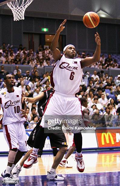 Ali Saad of Qatar battles for the ball against Japan during the 2007 FIBA Asia Championship game at Asty Tokushima on August 05, 2007 in Tokushima,...