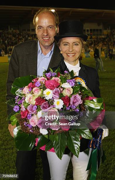 German Family Minister Ursula von der Leyen and her husband Heiko von der Leyen pose for a picture after she rode dressage with Hannoverer horse...