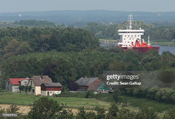 Cargo ship passes along the North Baltic Sea Canal August 3, 2007 at Brunsbuettel, Germany. The canal, first completed in 1895, is 99km long and...