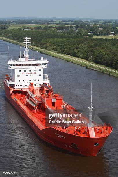 Cargo ship passes along the North Baltic Sea Canal August 3, 2007 at Brunsbuettel, Germany. The canal, first completed in 1895, is 99km long and...