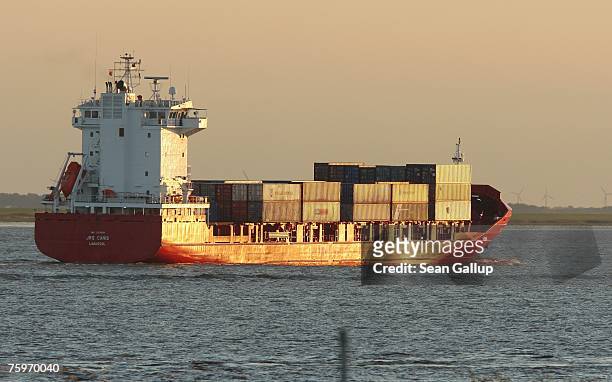 Container ship heads toward the North Sea on the Elbe River August 3, 2007 at Brunsbuettel, Germany. Northern Germany, with its busy ports of...