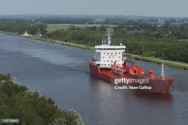 Cargo ship passes along the North Baltic Sea Canal August 3, 2007 at Brunsbuettel, Germany. The canal, first completed in 1895, is 99km long and...