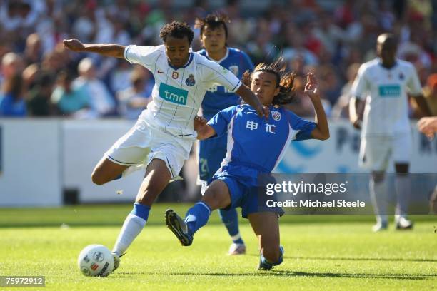 Tarik of Porto challenged by Xiao Zhan Bo during the Port of Rotterdam Tournament match between FC Porto and Shanghai Shenhua at the De Kuip Stadium...