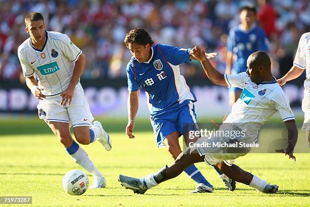 Blanco Soto of Shanghai skips the challenge of Joao Paulo watched by Stepanov during the Port of Rotterdam Tournament match between FC Porto and...