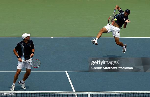 Andy Ram of Israel returns a shot to Mike and Bob bryan while playing with jonathan Erlich of Israel during the doubles final of the Legg Mason...