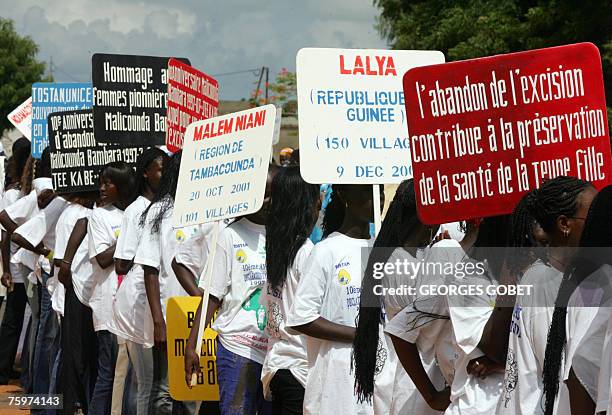 Young girls representing some 2700 villages in Senegal and neighbouring countries march 05 August 2007 in the main street of Malicounda Bambara, to...