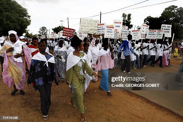 Young girls representing some 2700 villages in Senegal and neighbouring countries march 05 August 2007 in the main street of Malicounda Bambara, to...