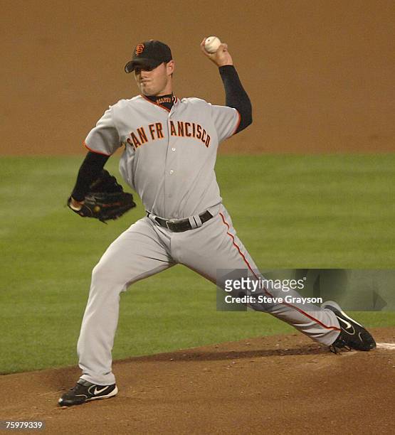Noah Lowry of the San Francisco Giants delivers a pitch against the during their contest against the Los Angeles Dodgers at Dodger Stadium in Los...
