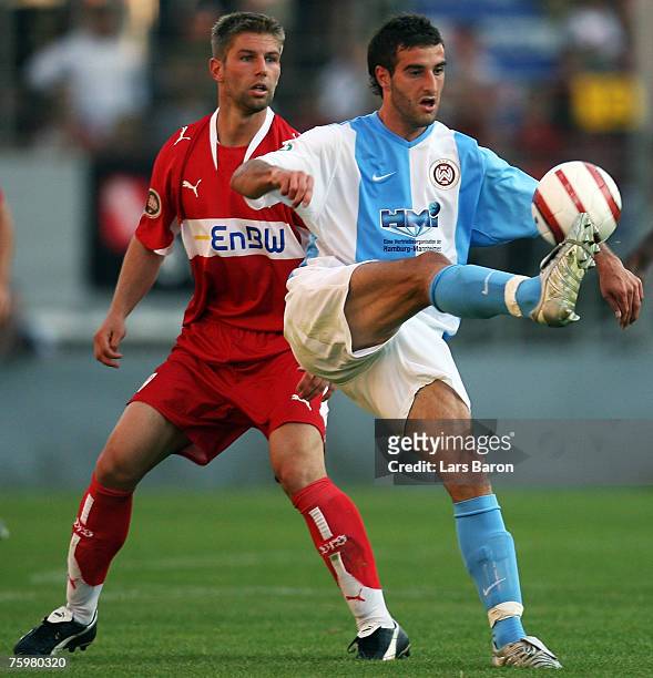 Thomas Hitzlsperger of Stuttgart in action with Maximilian Nicu of Wehen during the German Football Association Cup first round match between SV...