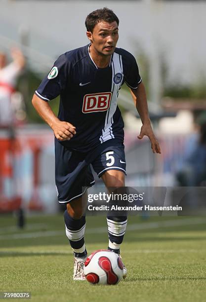 Sofian Chahed of Berlin runs with the ball during the German Football Association Cup first round match between SpVgg Unterhaching and Hertha BSC...