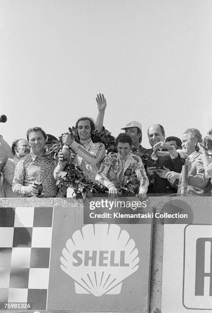 Co-drivers Sandro Munari, holding the champagne bottle, and Arturo Merzario celebrate their victory at the Targa Florio, Sicily, 21st May 1972.