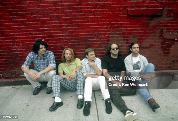 Jeff Tweedy, Jay Bennett, John Stirratt and Ken Coomer of the alt country band "Wilco" pose for a portrait with another man in 1996 in New York City,...