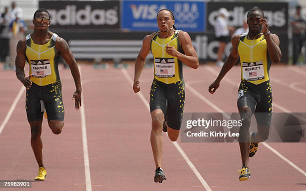 Xavier Carter, Wallace Spearmon and LaShawn Merritt sprint down the homestretch of the 200 meters in the adidas Track Classic at the Home Depot...