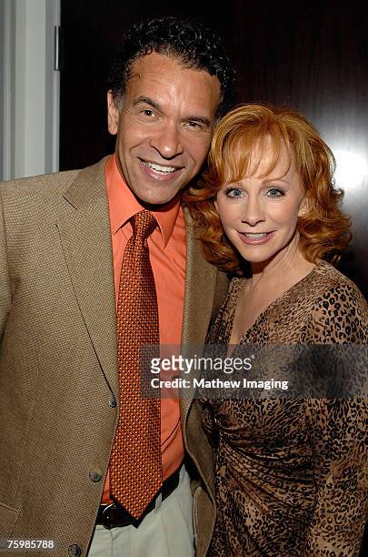 Actor and singer Brian Stokes Mitchell and actress and singer Reba McEntire backstage at the Hollywood Bowl on August 4, 2007 in Hollywood California.