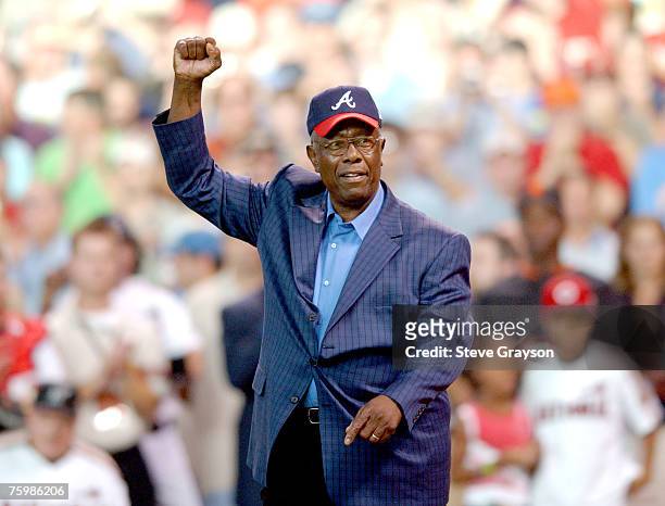 Hank Aaron waves to the crowd as he is saluted as one of the members of the 500 home run club prior to the start of the 2004 Home Run Derby at Minute...