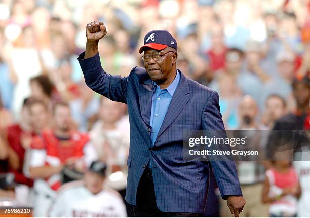 Hank Aaron waves to the crowd as he is saluted as one of the members of the 500 home run club prior to the start of the 2004 Home Run Derby at Minute...