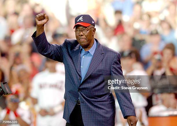 Hank Aaron waves to the crowd as he is saluted as one of the members of the 500 home run club prior to the start of the 2004 Home Run Derby at Minute...