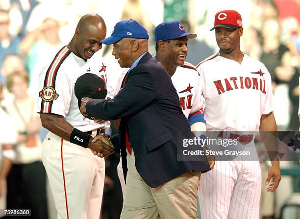 Ernie Banks aka "Mr Cub" is greeted by Barry Bonds, Sammy Sosa and Ken Griffey Jr. As he is saluted as one of the members of the 500 home run club...