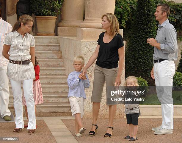 Elena of Spain, her daughter Victoria Federica, Cristina of Spain, her husband I?aki Urdangarin and her sons Irene and Miguel pose for Photographers...