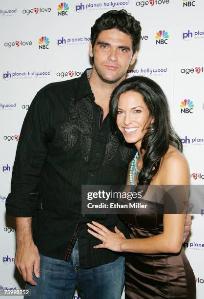 Tennis player Mark Philippoussis and Amanda Salinas pose after watching the finale of the television show "Age of Love" at the EXTRA Lounge Planet...