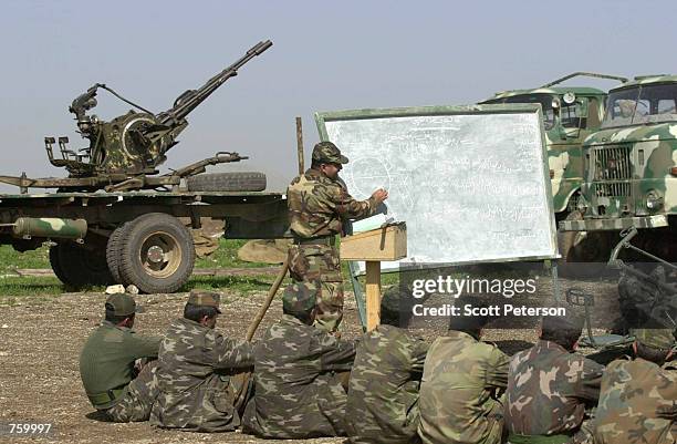 Soldiers of the Patriotic Union of Kurdistan - one of the two main armed Kurdish factions in the "safe haven" in northern Iraq - receive instructions...