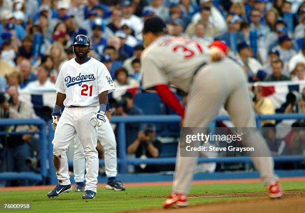 Milton Bradley of the Los Angeles Dodgers eyes Jeff Suppan of the St. Louis Cardinals as he looks the signal in game four of the of the National...