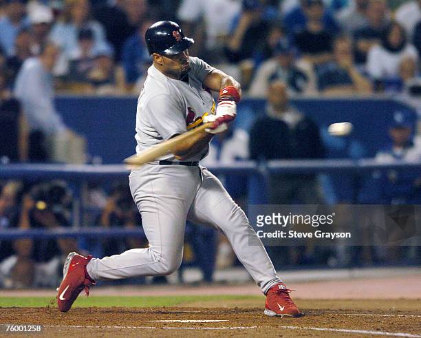 Albert Puljos of the St. Louis Cardinals connects on a fourth inning home run off Wilson Alverez of the Los Angeles Dodgers in game four of the...