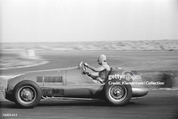 Alberto Ascari cornering in his Ferrari 125/F1 during the International Daily Express Trophy Race; at Silverstone, 20th August 1949. He won the final...