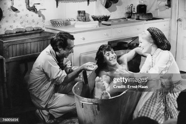 Arthur Penn directs actors Dustin Hoffman and Faye Dunaway in the bath scene from the film 'Little Big Man', 1969.