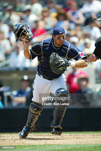 Josh Bard of the San Diego Padres chases a pop fly during the game against the Arizona Diamondbacks at Petco Park in San Diego, California on August...