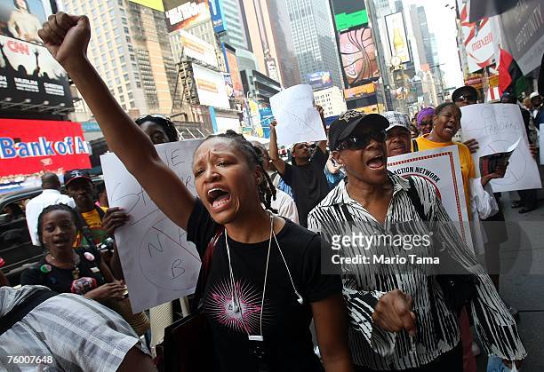 Kesha Moore and other demonstrators protest outside a Virgin Music Store during a national "day of outrage" organized by Rev. Al Sharpton August 7,...