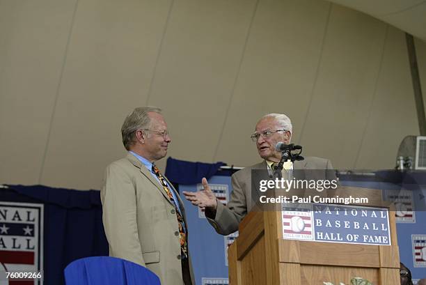 Gary Thorn of ESPN and Bobby Doerr talk on stage during the Baseball Hall of Fame Induction Ceremonies at the Clark Sports Center in Cooperstown, New...