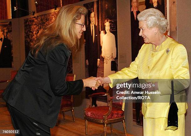 Queen Elizabeth ll greets photographer Annie Leibovitz at a reception for American based in England at Buckingham Palace on March 27, 2007.