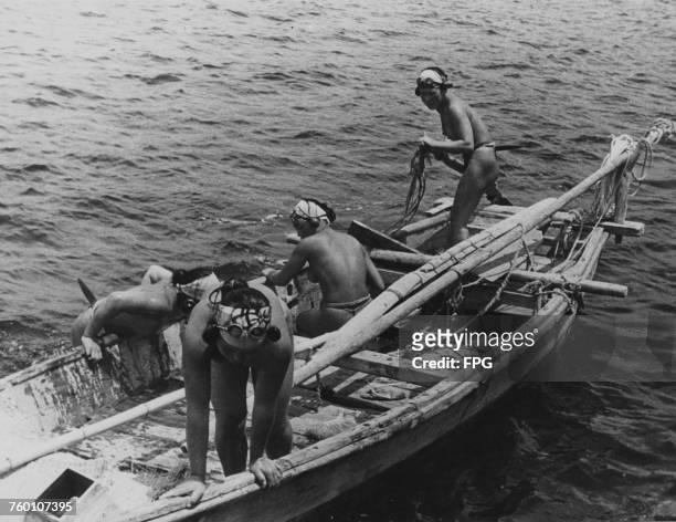 Japanese Ama pearl divers aboard their boat, Japan, circa 1955.
