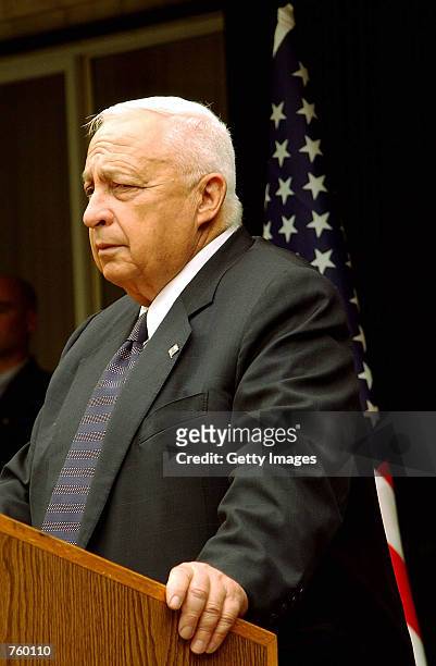 Israeli Prime Minister Ariel Sharon listens during a joint press conference with U.S. Secretary of State Colin Powell April 12, 2002 at Sharon's...