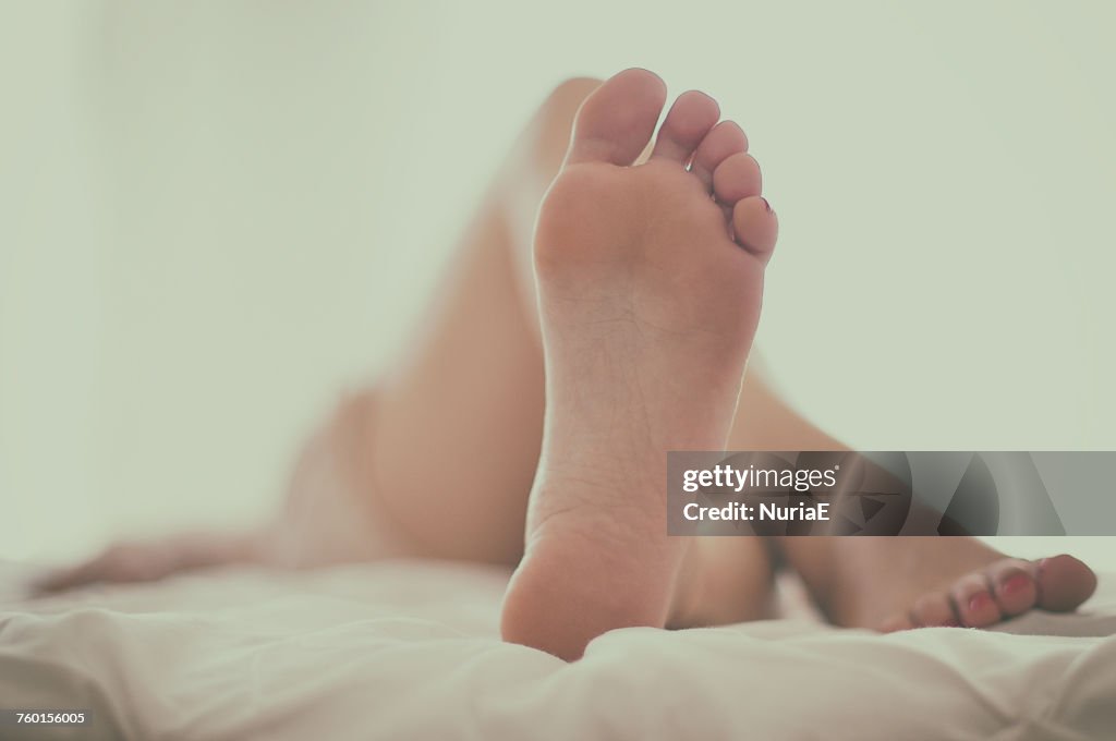 Woman lying on a bed