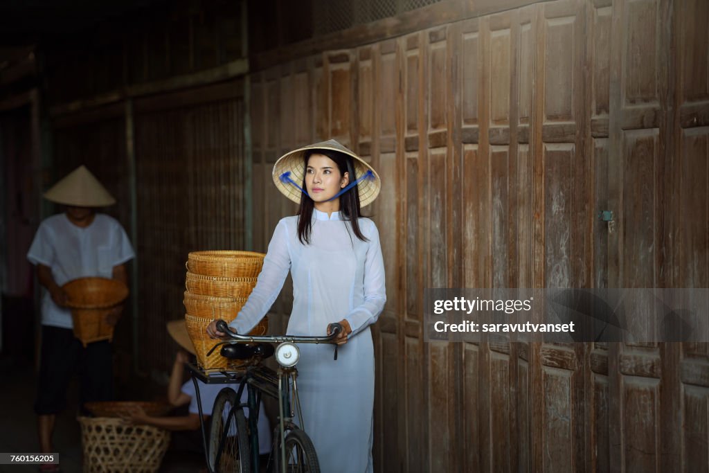 Woman with a bicycle, Vietnam