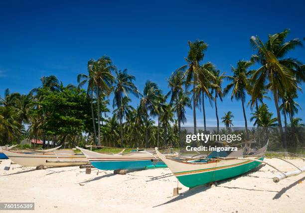 fishing boats on beach, guimbatayan, cebu island, philippines - cebu philippines stock pictures, royalty-free photos & images