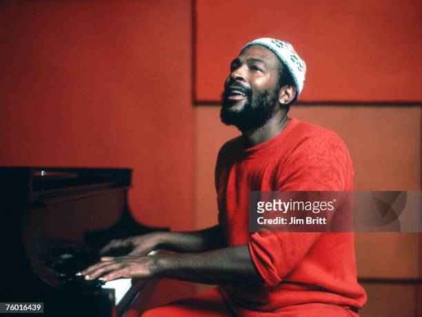 Soul singer Marvin Gaye plays piano as he records in a studio in circa 1974.