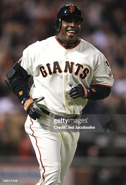 Barry Bonds of the San Francisco Giants celebrates after hitting career home run against Mike Bacsik of the Washington Nationals on August 7, 2007 at...