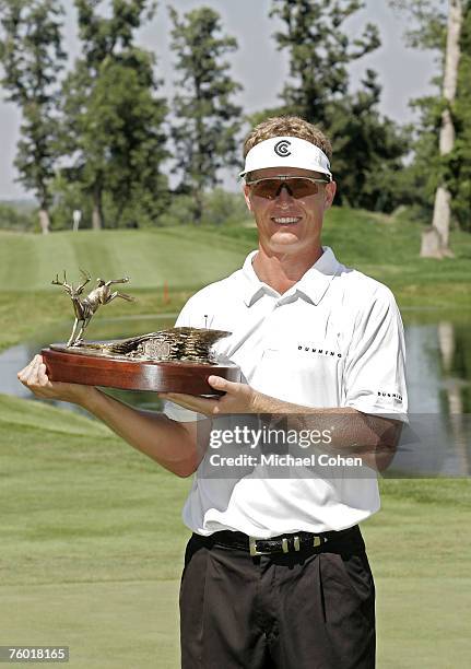 John Senden holds the trophy after winning the John Deere Classic at TPC Deere Run in Silvis, Illinois on July 16, 2006.