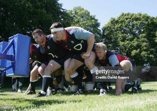 Mark Regan , Andrew Sheridan and Lewis Moody practice on the scrum machine during the England rugby union training session held at Bath University on...