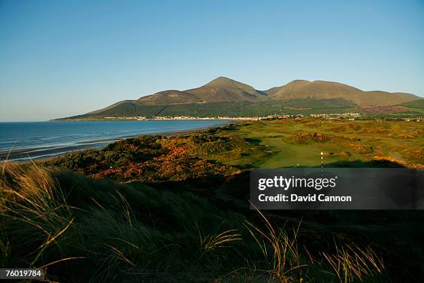 View looking down over the 477 yards par 4, 3rd hole and the rest of the links towards the town of Newcastle and the Mourne Mountains on the...