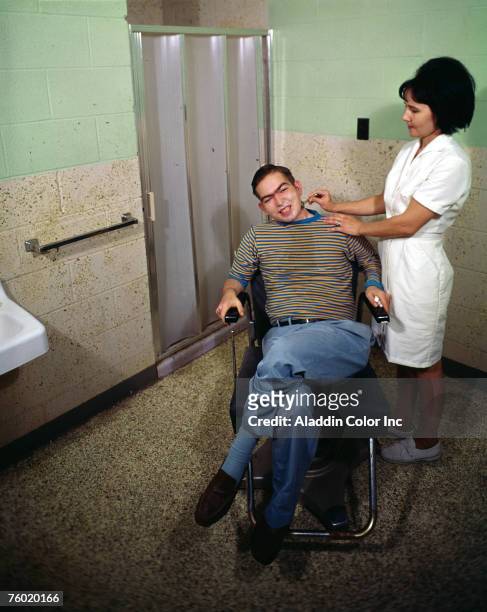 Nurse uses a safety razor to shave a male patient at the Whiteville Convelescent Center, Whiteville, North Carolina, 1960s.