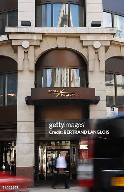 Man walks by the offices of the Royal and Sun Alliance in London, 08 August 2007. British insurer Royal and Sun Alliance said today it planned to...